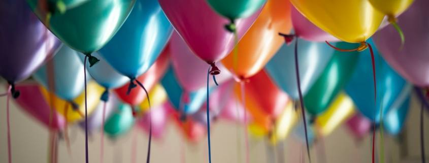 selective focus photography of assorted-color balloons